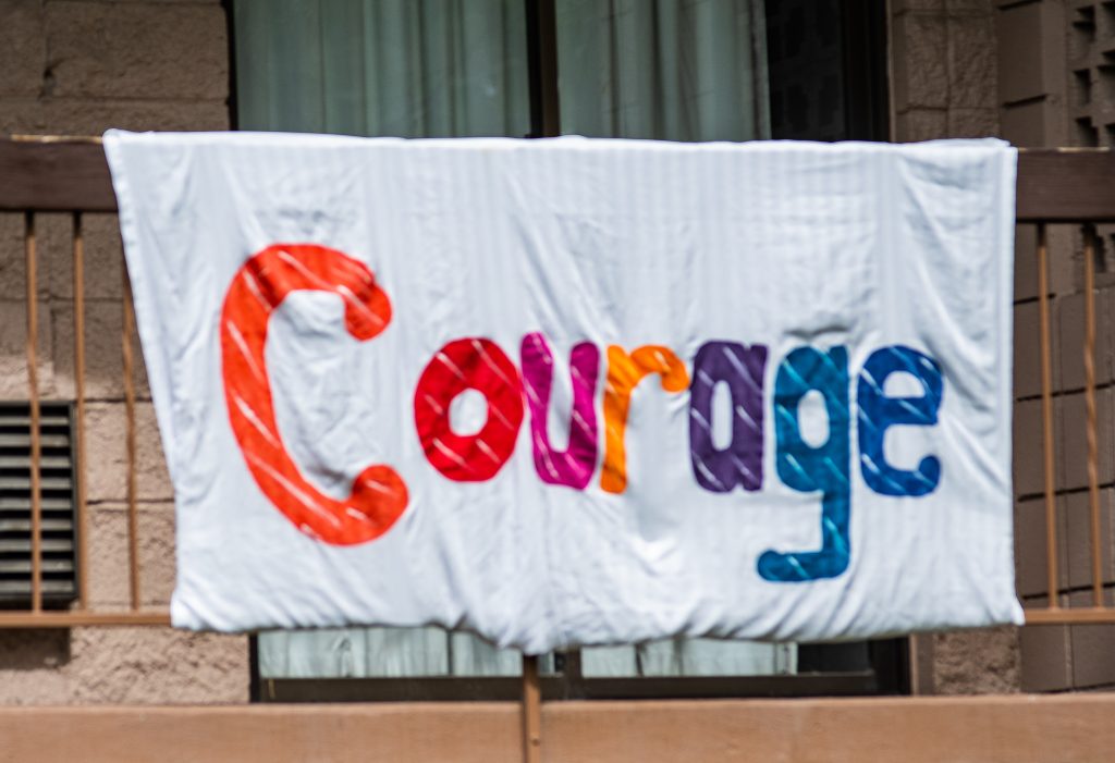 Pictures of the hopeful banners hanging from the Cottonwood Hotel during COVID 19.