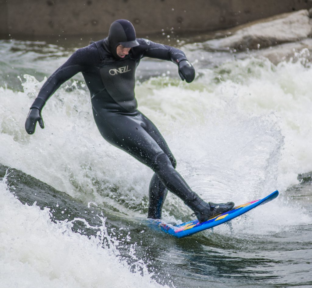 Photographs of surfers at Whitewater Park in Boise, Idaho in 2018. Photos by Terry Welch.